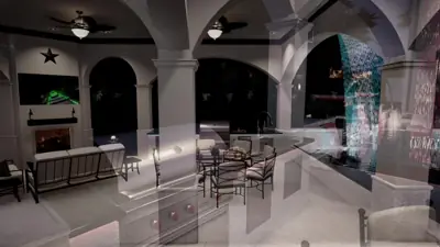 Loggia lounge with sofa and dining, ceiling fans, pool and fire visible through the arches