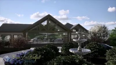 Front elevation of the timber-frame lodge with glass gables, a tiered stone fountain and flowering trees in morning light