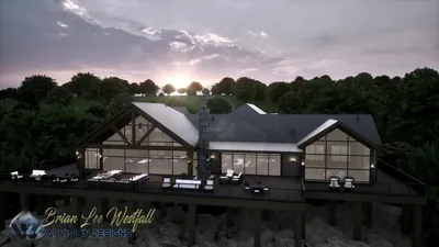 Lodge and deck at dusk with interior lights on, seen from the lake side